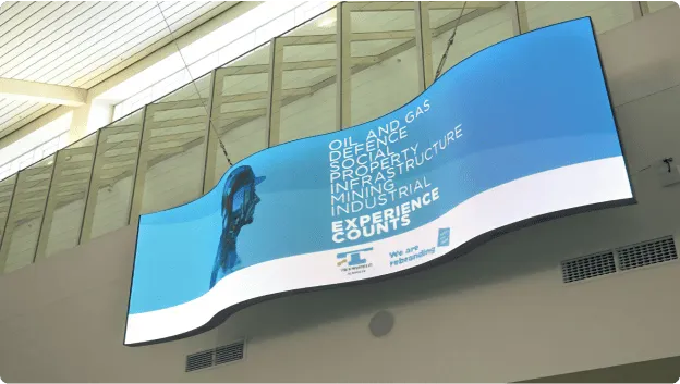 Curved LED vision installed on an indoor wall of an office building.