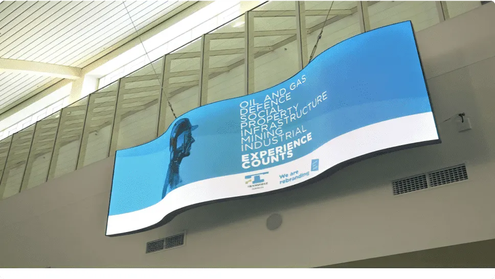 Curved LED vision installed on an indoor wall of an office building.